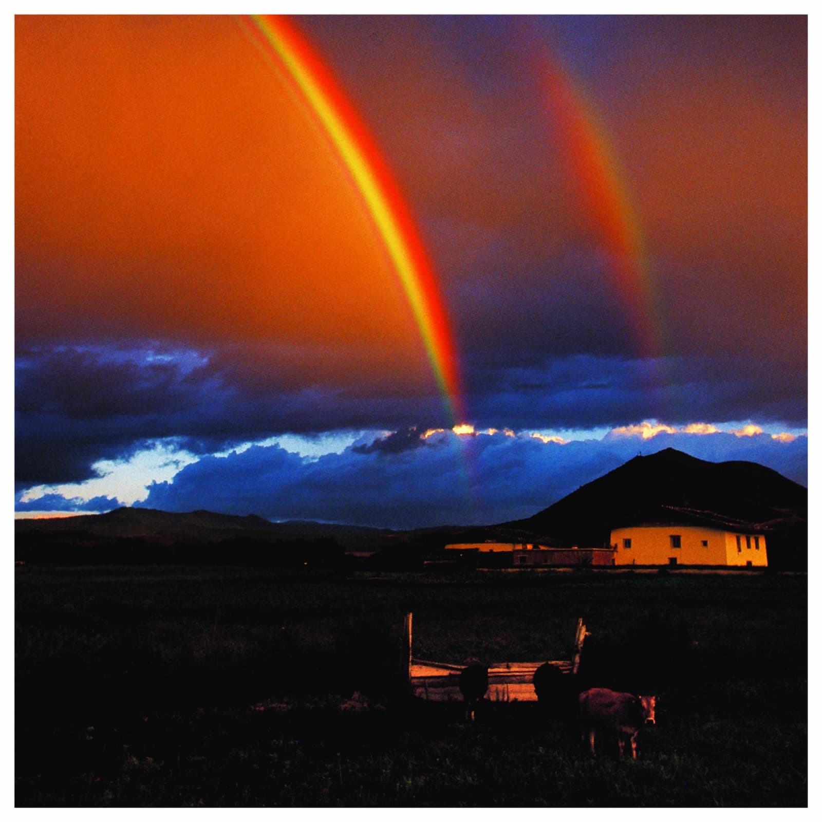 Double rainbow over highland village
